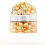 Jar of gold capsules on a white background
