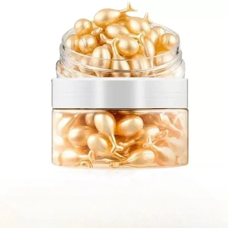 Jar of gold capsules on a white background